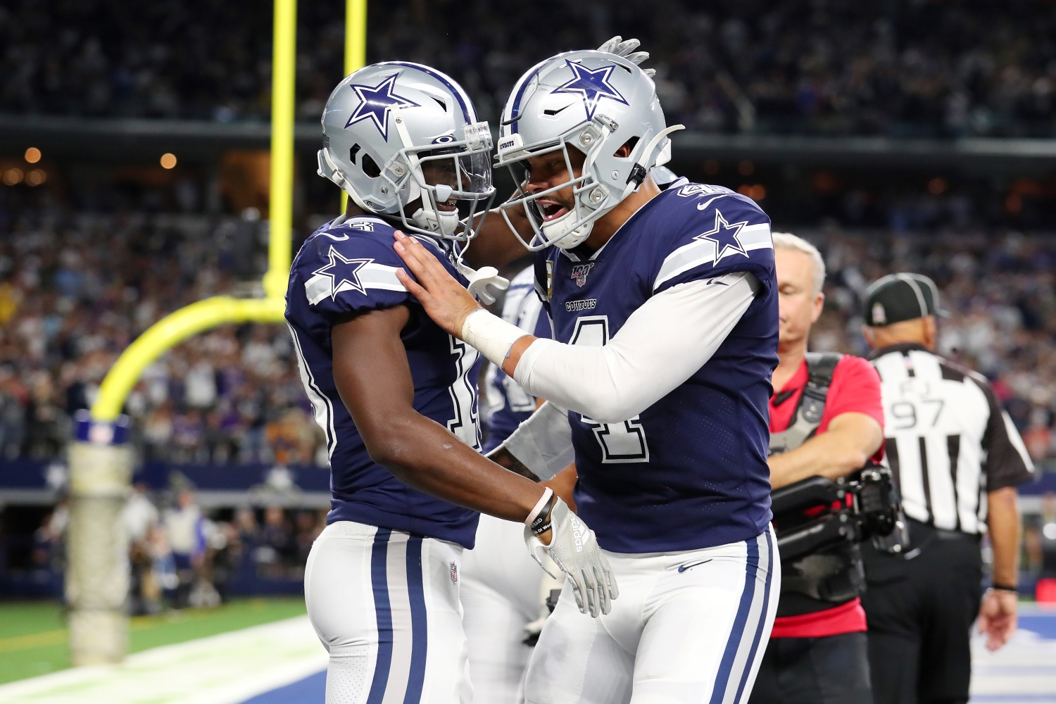 Dallas Cowboys WR Michael Gallup celebrates with Dak Prescott after scoring a touchdown.