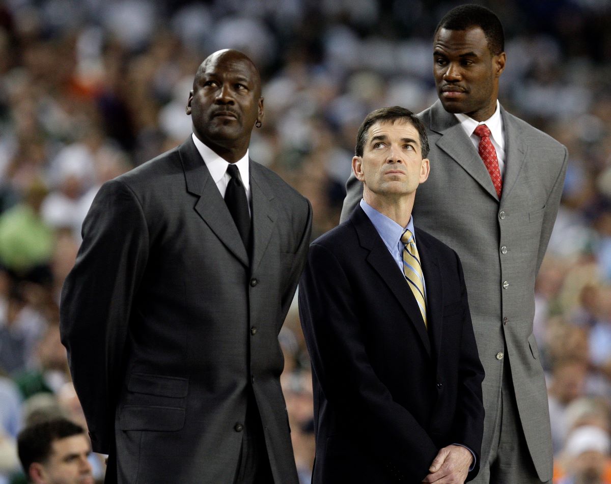 NBA players Michael Jordan, John Stockton, and David Robinson celebrate being NBA Hall of Fame members at the 2009 NCAA Championship