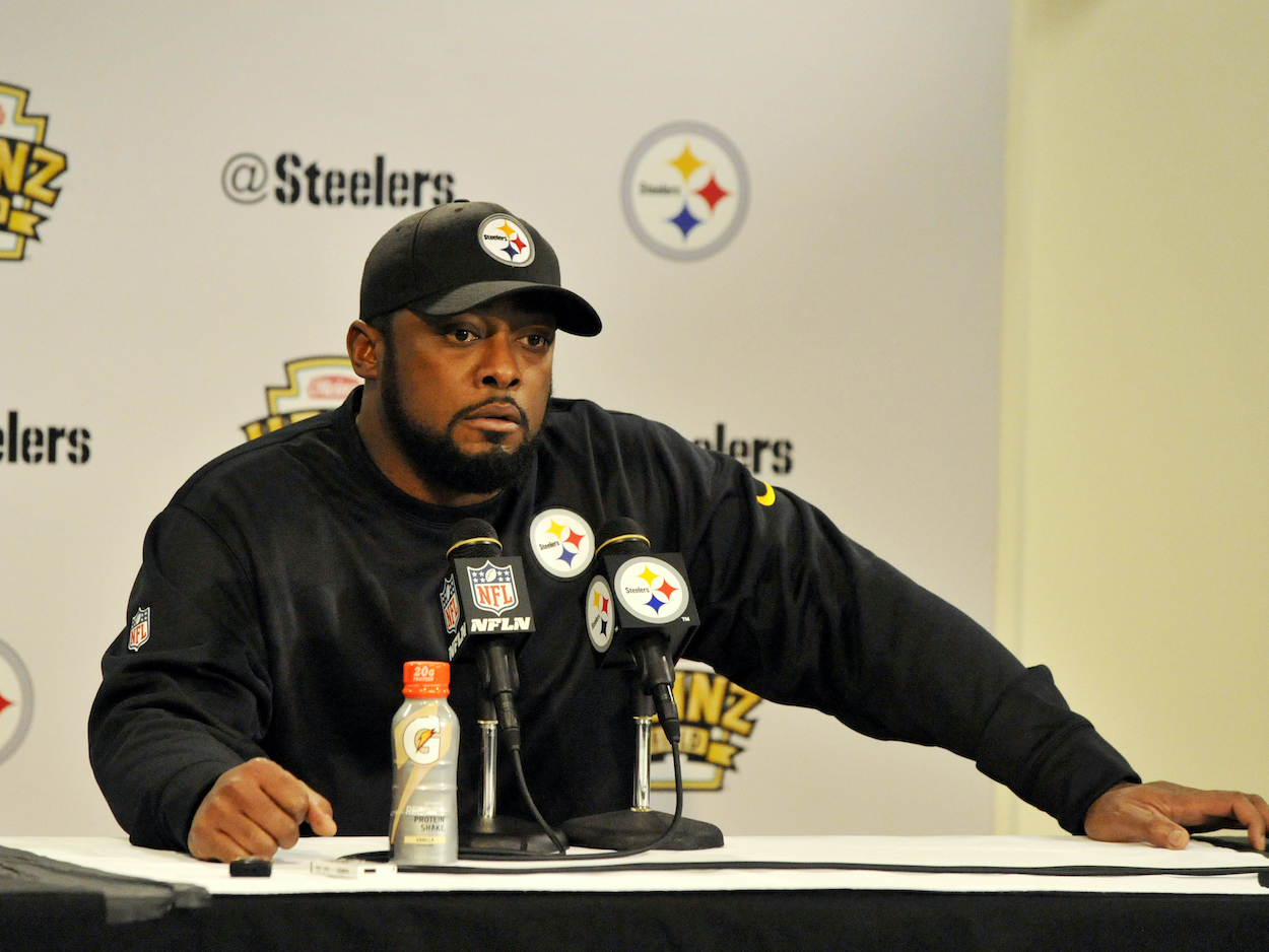 Head coach Mike Tomlin of the Pittsburgh Steelers, who stormed out of a press conference over questions about the USC job Tuesday, listens to questions from the media during a post-game press conference after a game against the Cleveland Browns on December 29, 2013 at Heinz Field in Pittsburgh, Pennsylvania. Pittsburgh won 20-7.