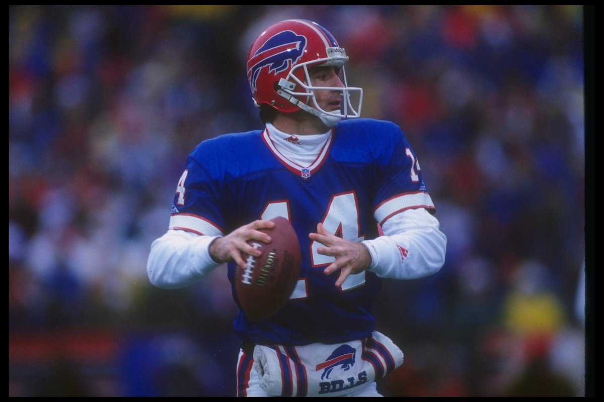 Quarterback Frank Reich of the Buffalo Bills looks to pass the ball during the 1993 playoff game against the Houston Oilers