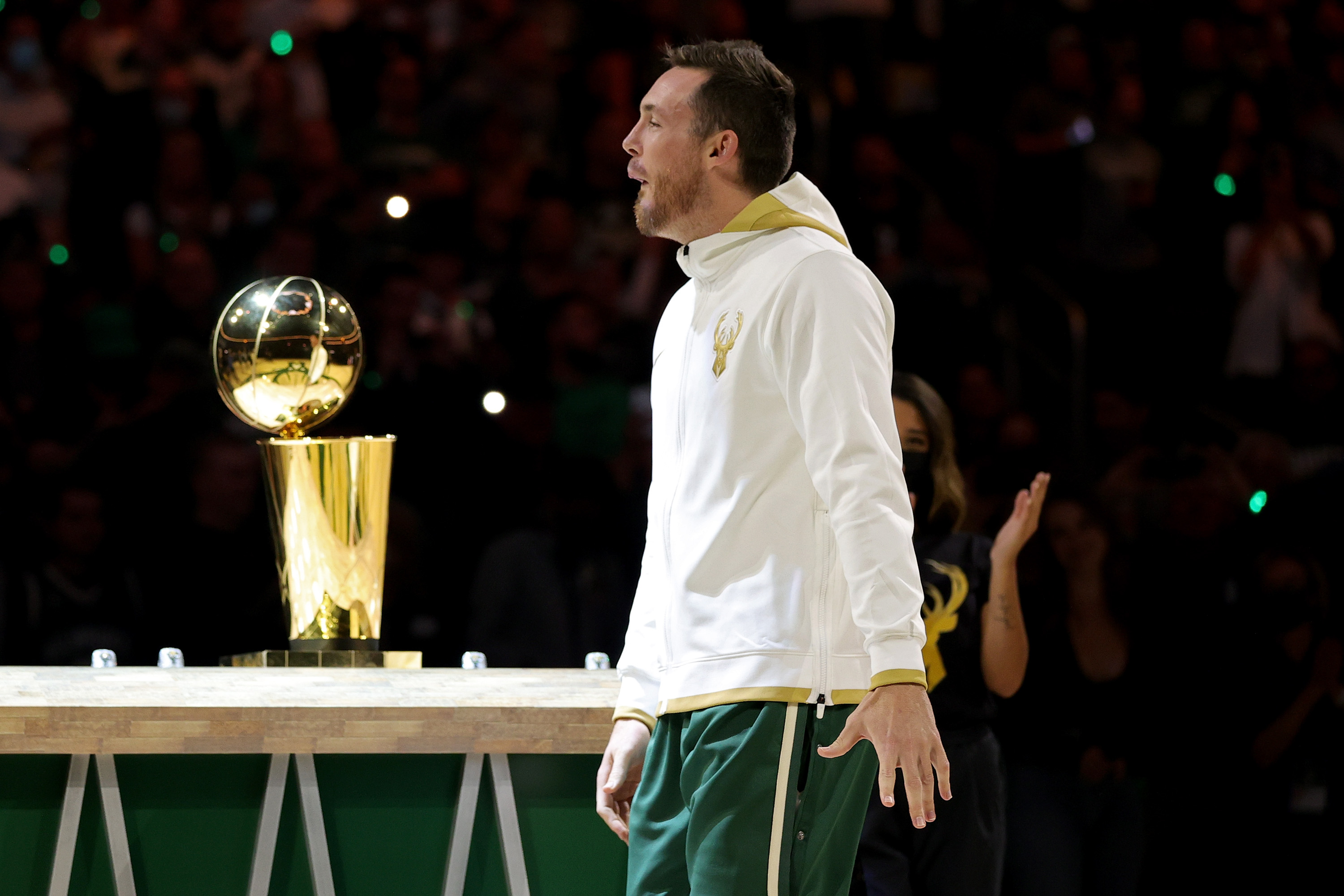 Milwaukee Bucks guard Pat Connaughton prepares to receive his championship ring