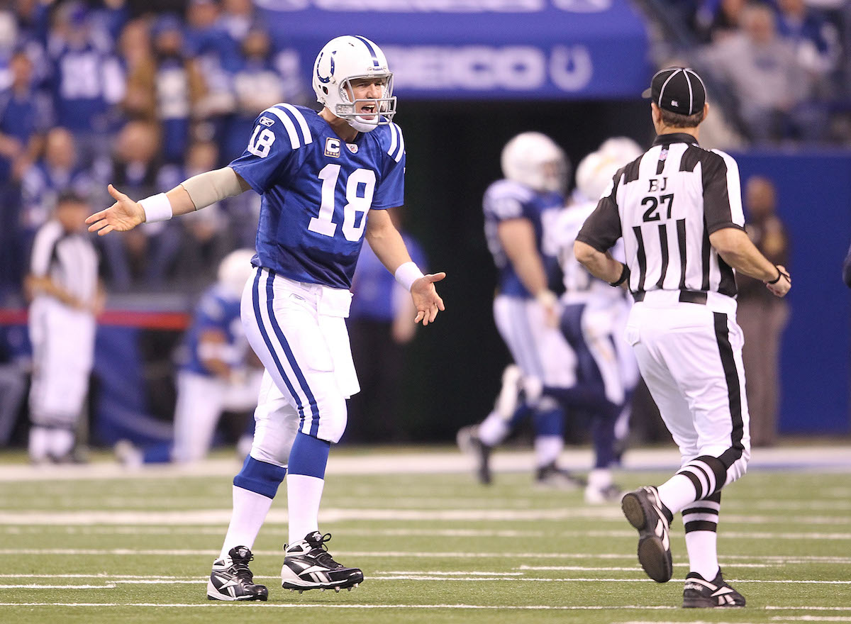 Peyton Manning, #18 of the Indianapolis Colts, complains to a referee after throwing an interception that was returned for a touchdown during the NFL game against the San Diego Chargers at Lucas Oil Stadium on November 28, 2010, in Indianapolis, Indiana