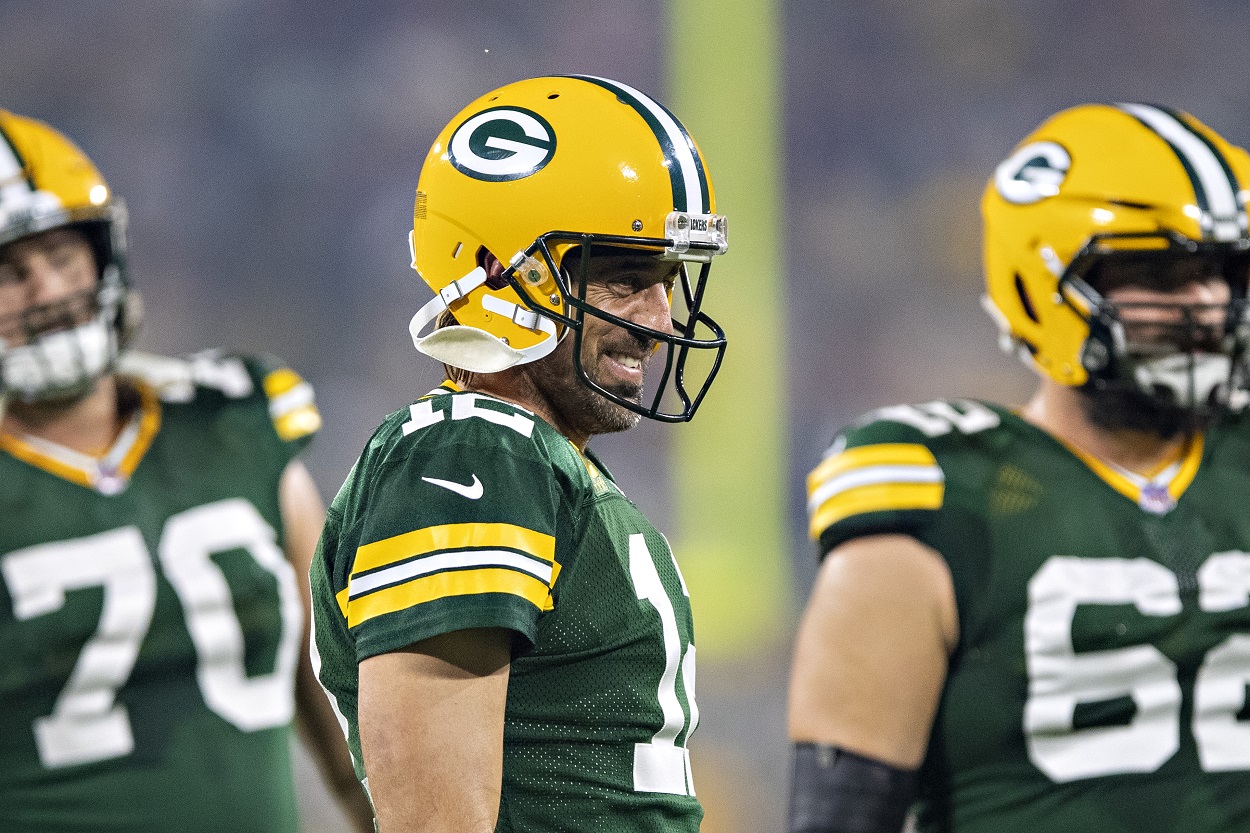 Aaron Rodgers of the Green Bay Packers smiles with his teammates