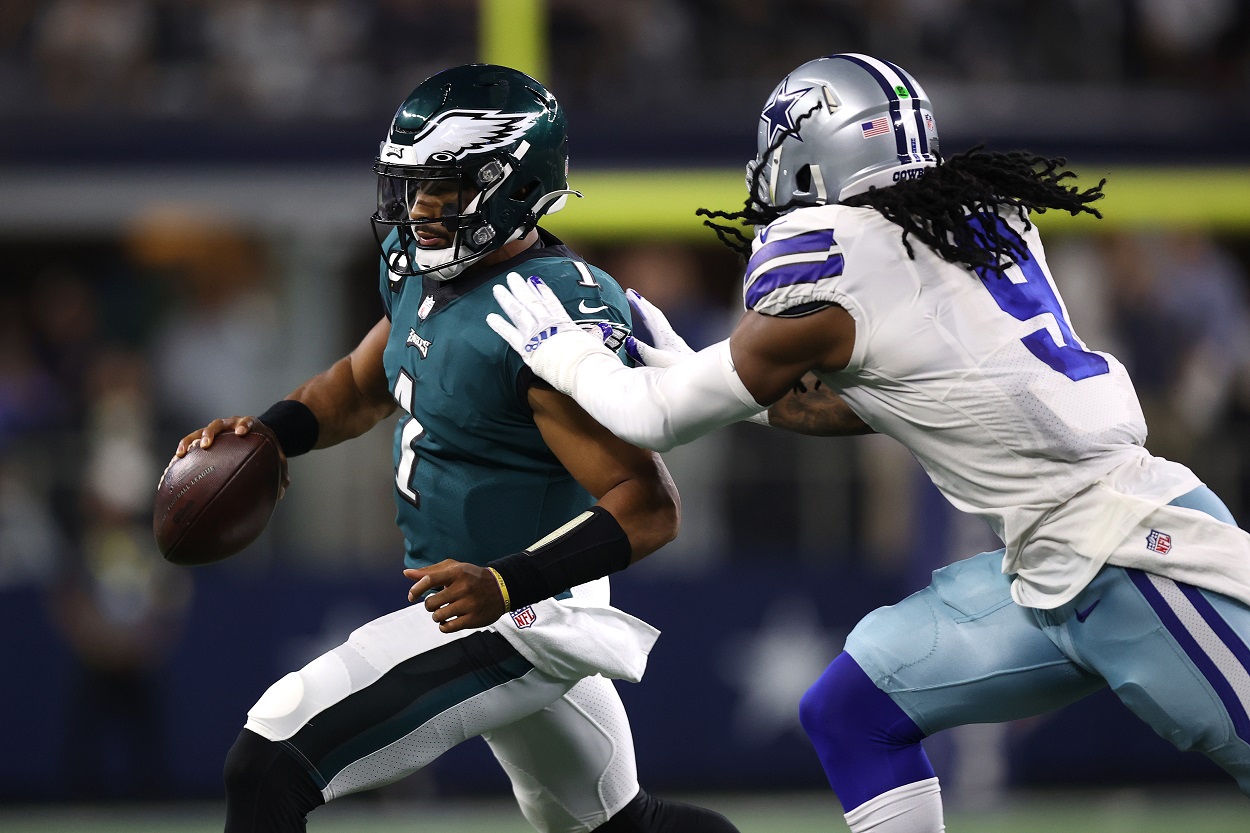 Jalen Hurts of the Philadelphia Eagles runs away from a Dallas Cowboys defender