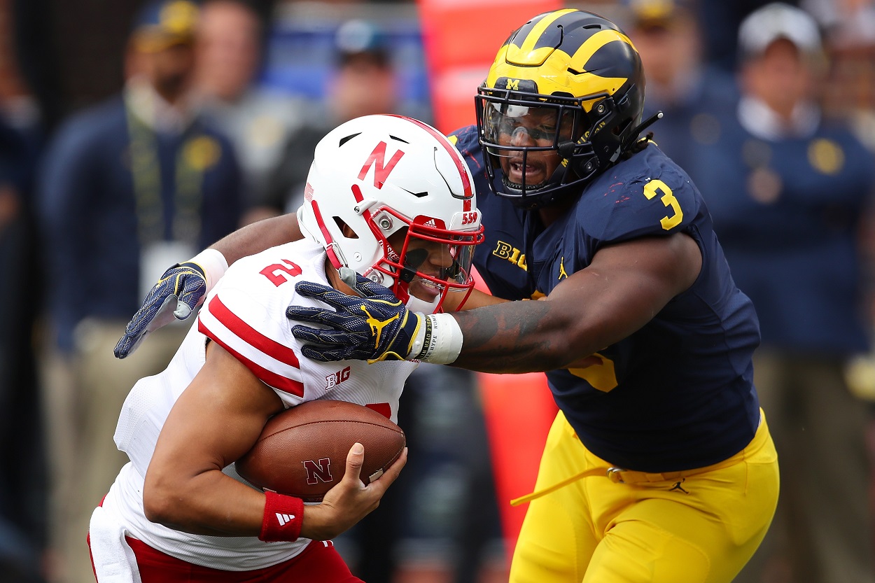 Rashan Gary makes a tackle while with the Michigan Wolverines 