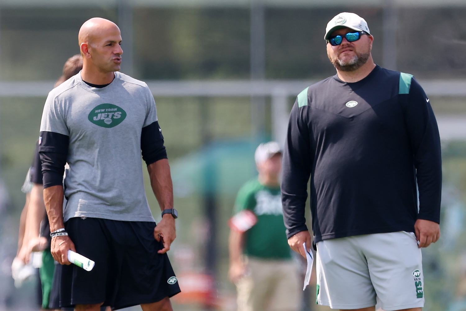 New York Jets head coach Robert Saleh and general manager Joe Douglas watch training camp practice.