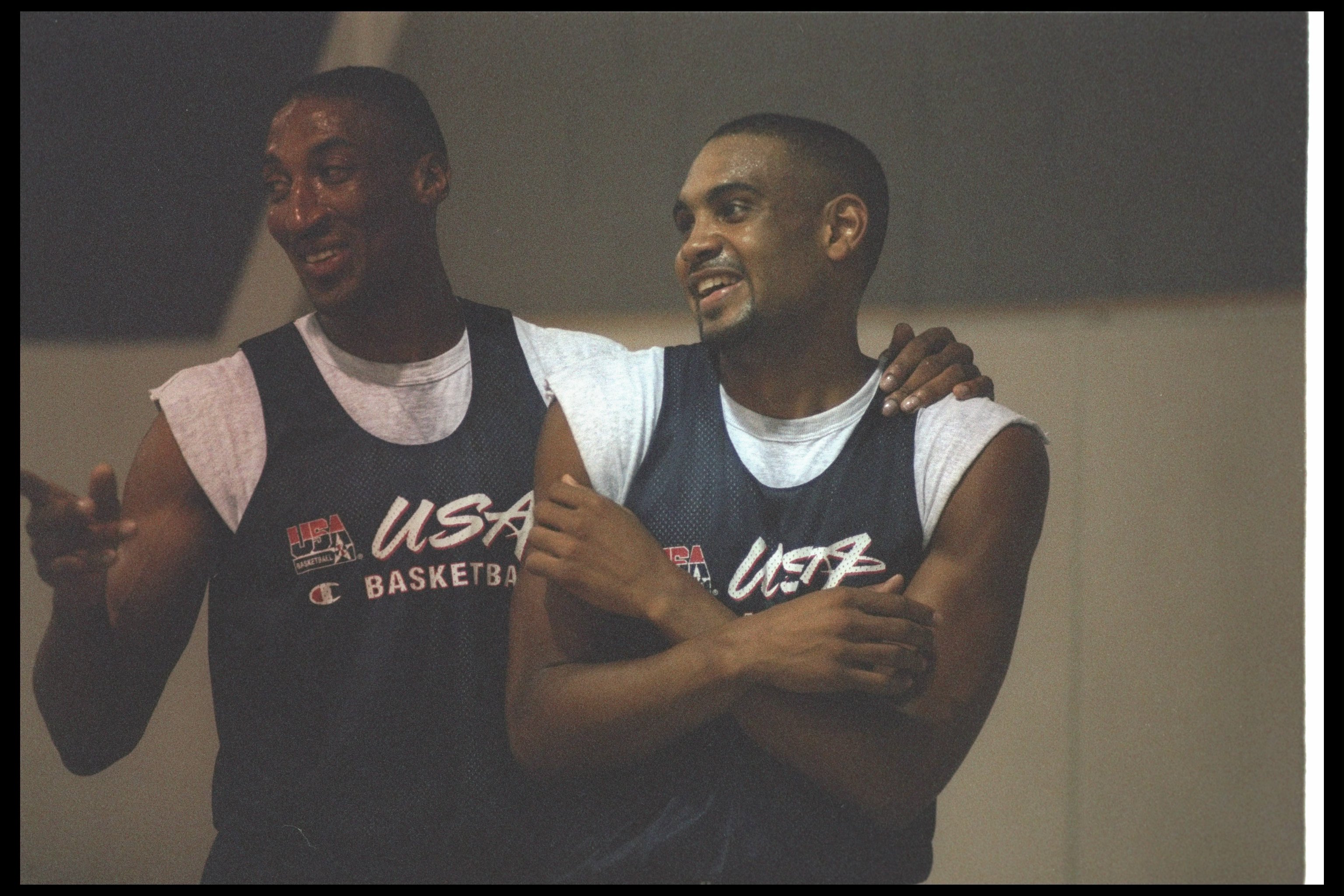 Former Bulls forward Scottie Pippen jokes with then-Pistons star Grant Hill during Team USA camp in 1996