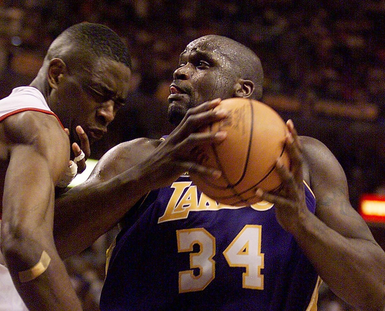 Former Lakers star Shaquille O'Neal backs into Dikembe Mutombo during the 2001 NBA Finals