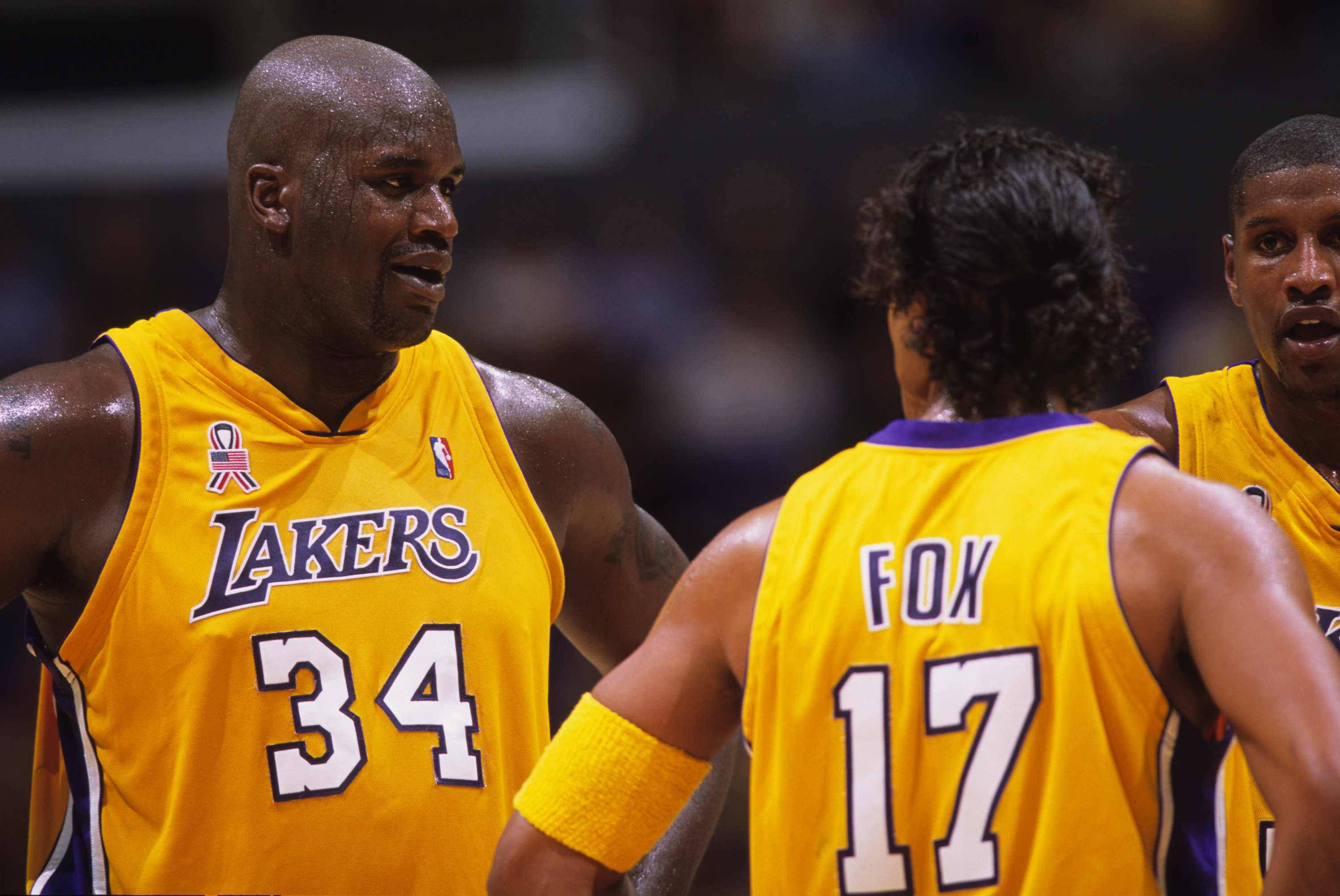 Shaquille O'Neal talks to former Lakers teammate Rick Fox