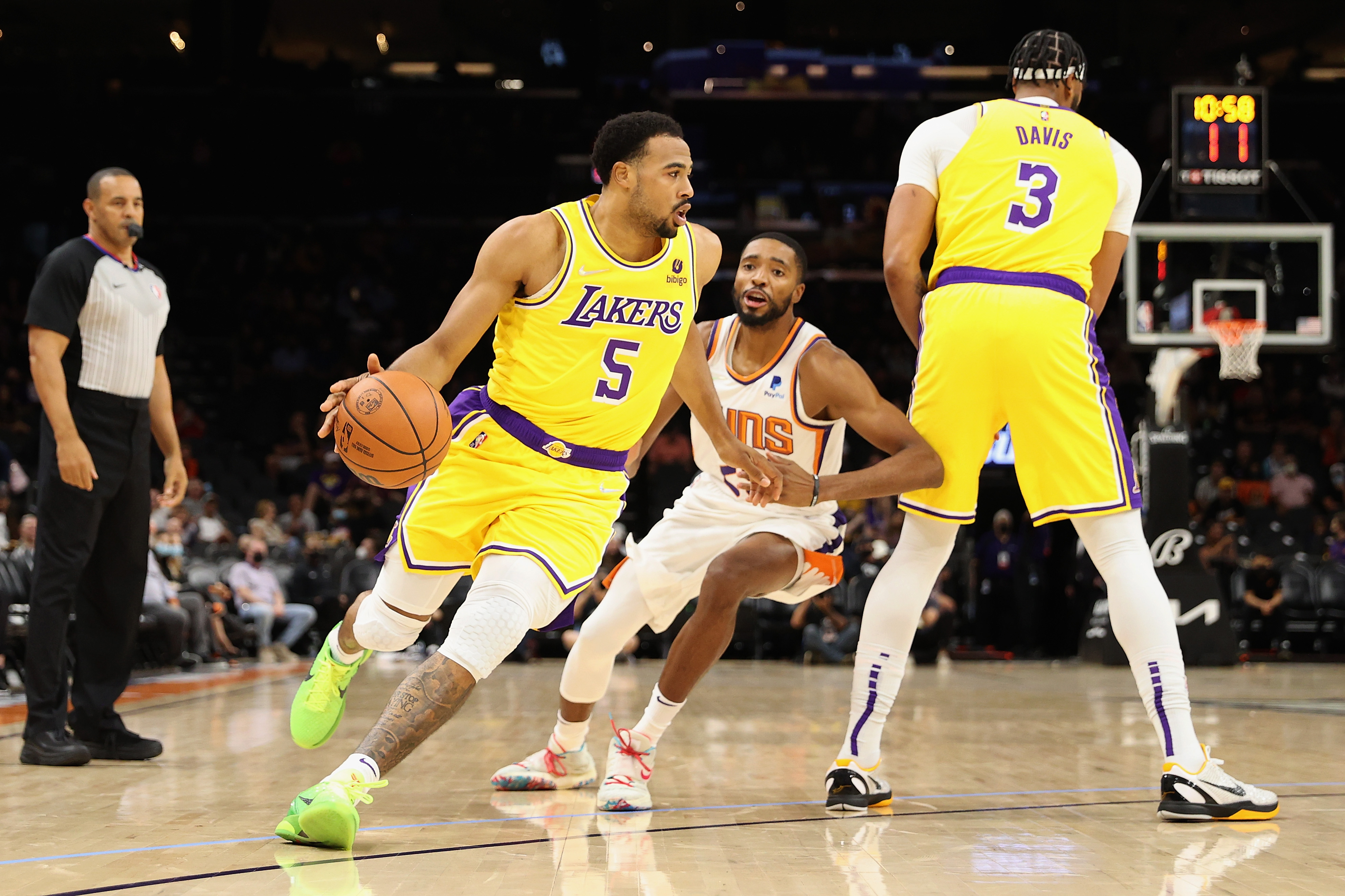 Los Angeles Lakers guard Talen Horton-Tucker works off a screen during an NBA preseason game