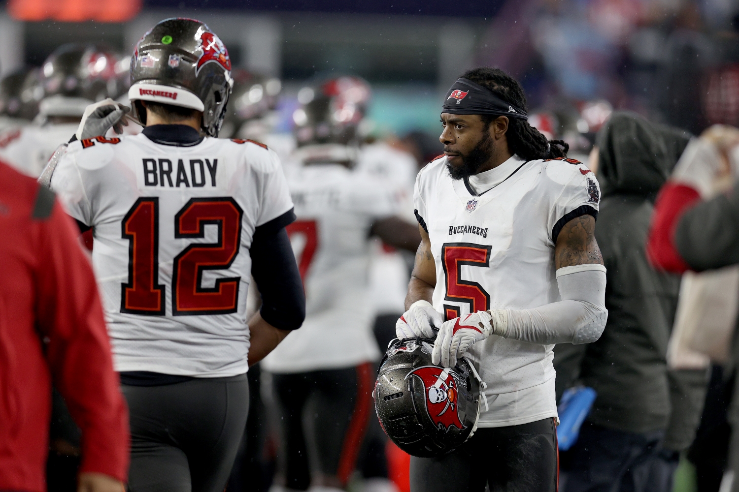 Tampa Bay Buccaneers cornerback Richard Sherman speaks to Tom Brady on the sidelines.