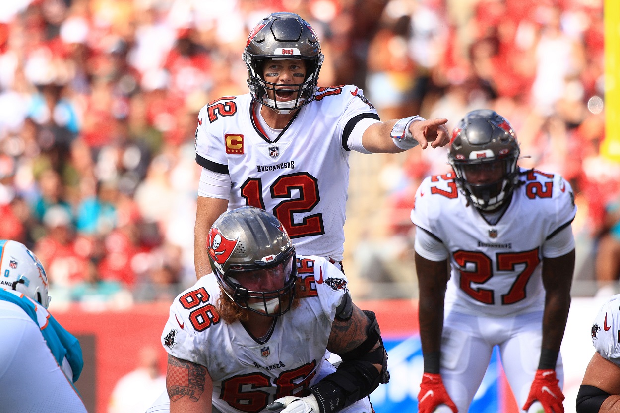 Tom Brady of the Tampa Bay Buccaneers scans the defense of the Miami Dolphins