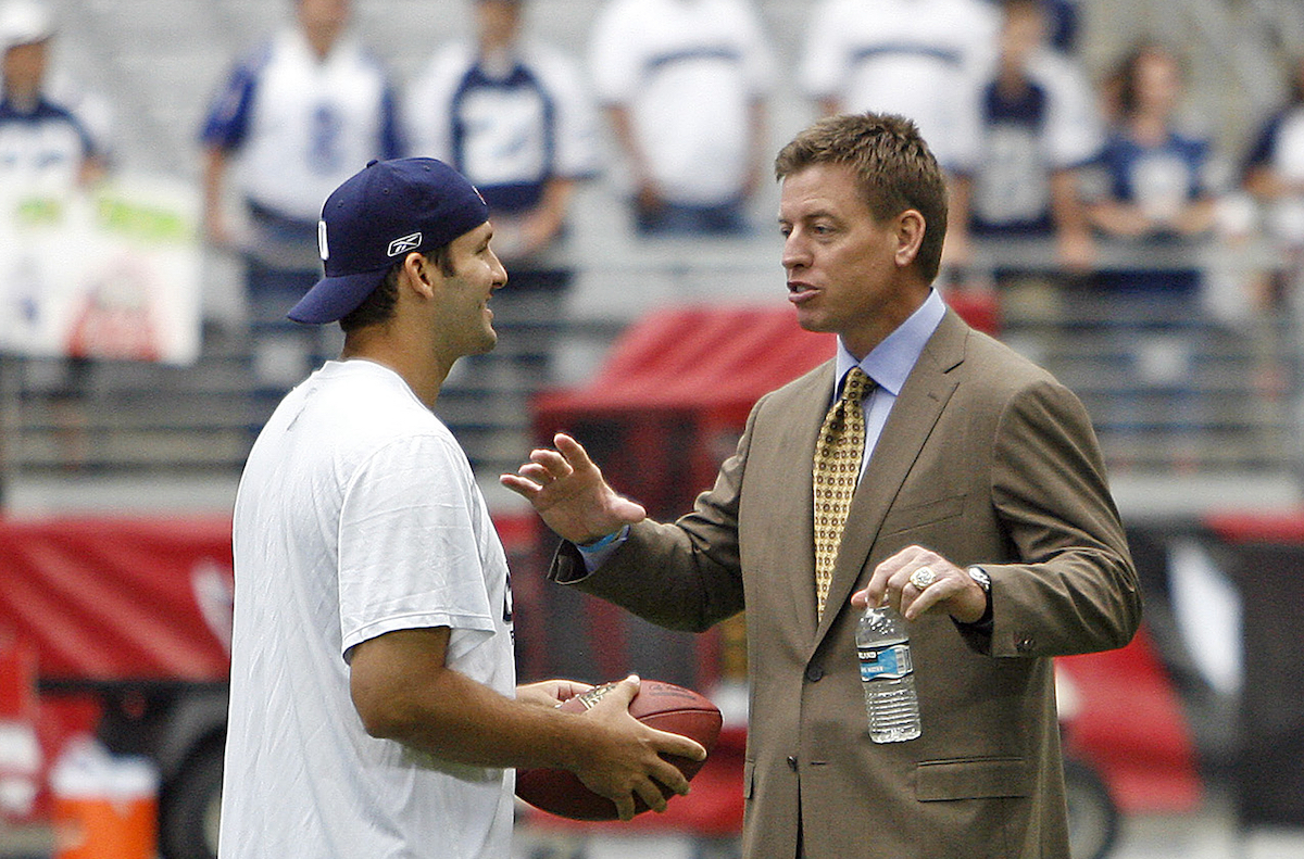Tony Romo and Troy Aikman talk before the Arizona Cardinals 30-24 win over the Dallas Cowboys at University of Phoenix Stadium in Glendale, Arizona, in October 2008