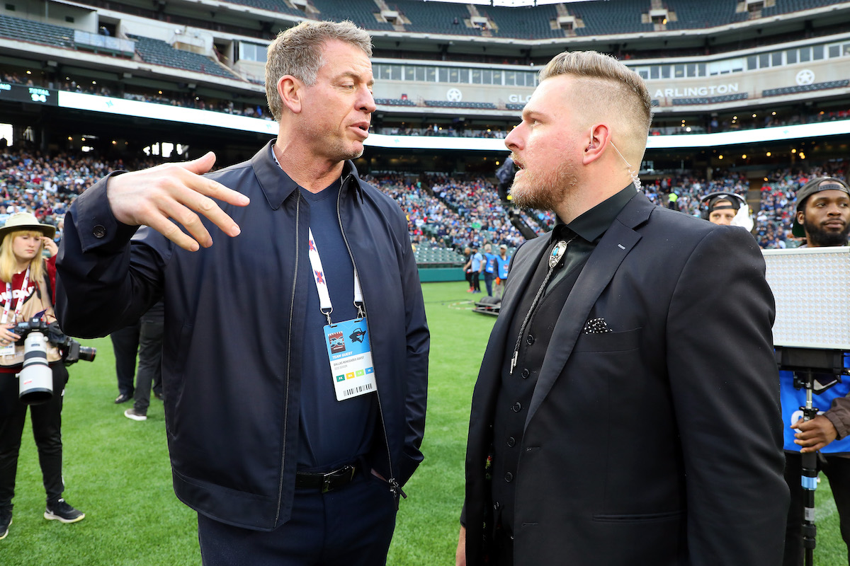 Troy Aikman talks to Pat McAfee on the sideline