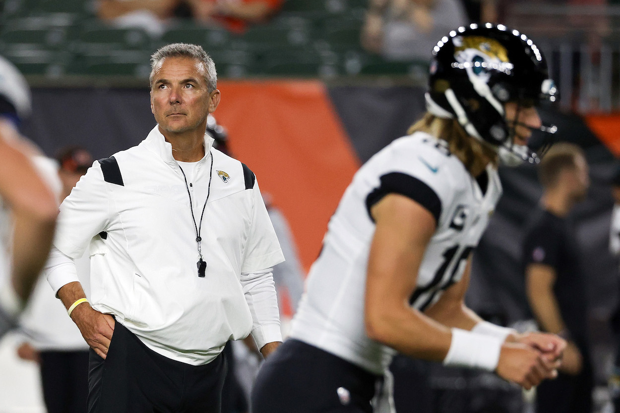 Urban Meyer looking over Jaguars QB Trevor Lawrence.