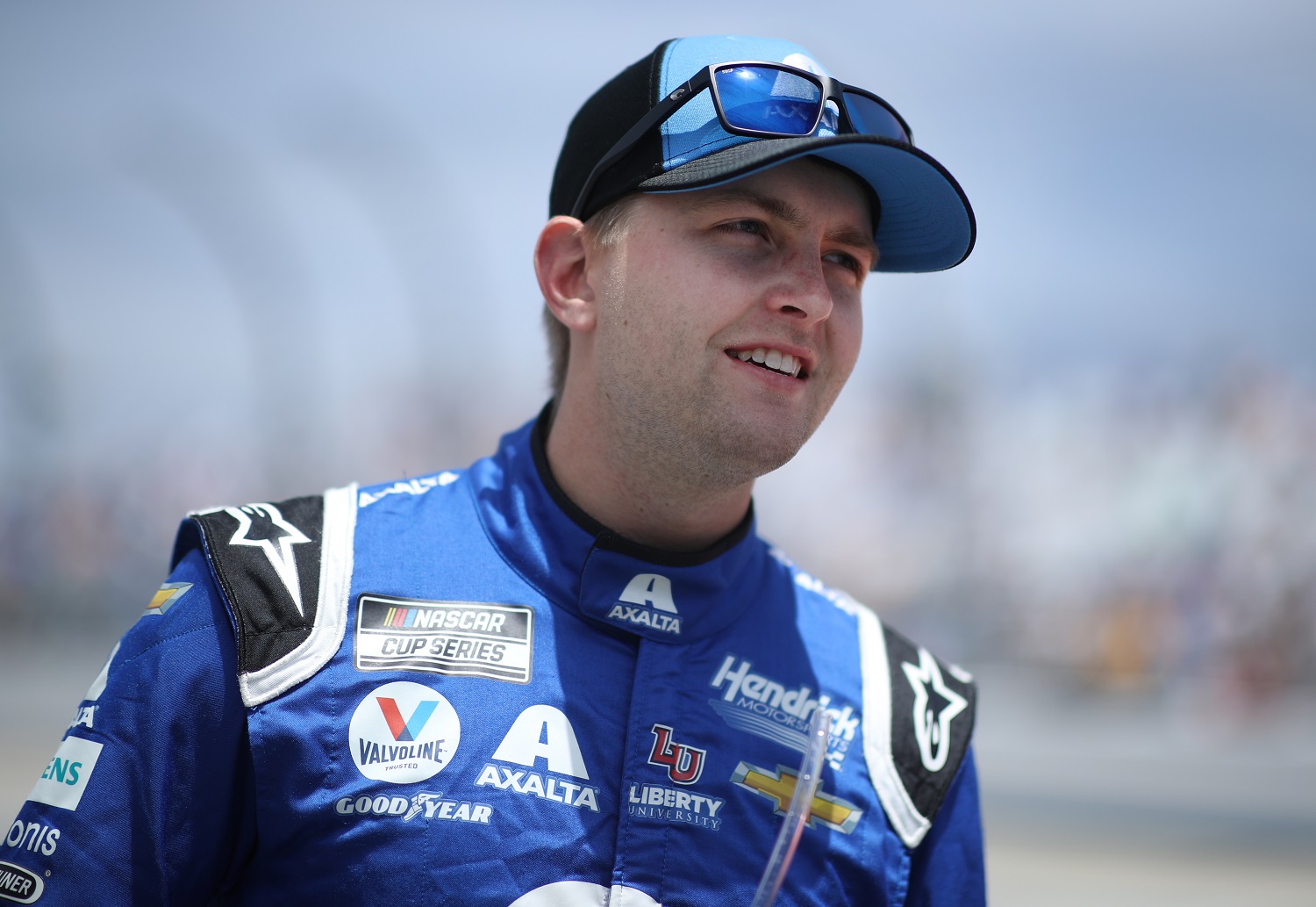 William Byron, driver of the No. 24 Chevrolet, walks on the grid during the NASCAR Cup Series Drydene 400 at Dover International Speedway on May 16, 2021.