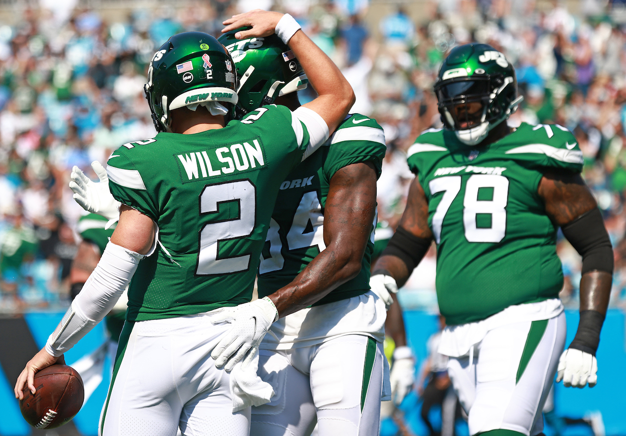 New York Jets quarterback Zach Wilson celebrates with Corey Davis
