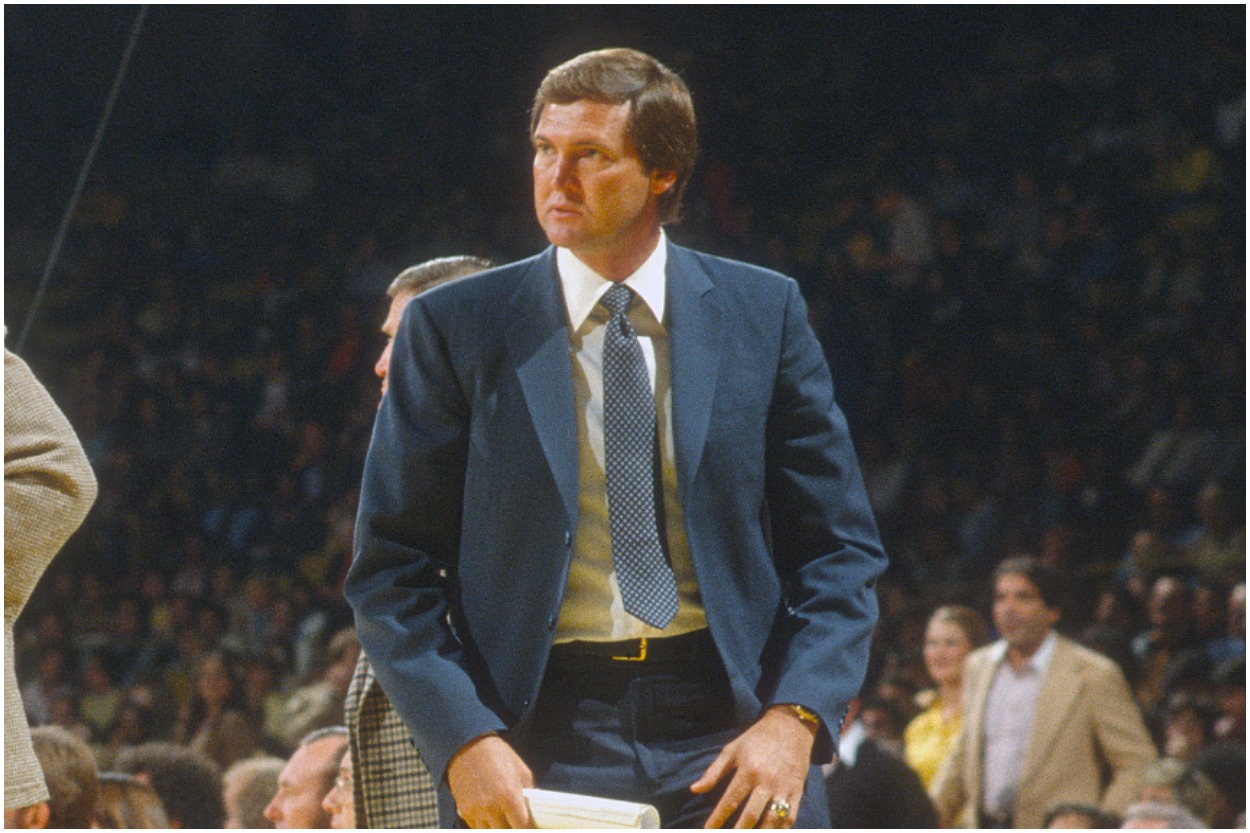 Jerry West standing in front of the bench while coaching the Los Angeles Lakers.