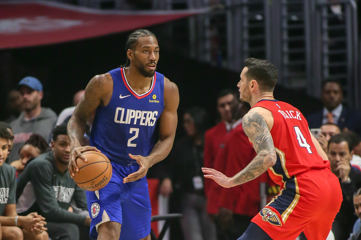 Kawhi Leonard of the LA Clippers looks to make a play while JJ Redick guards him.