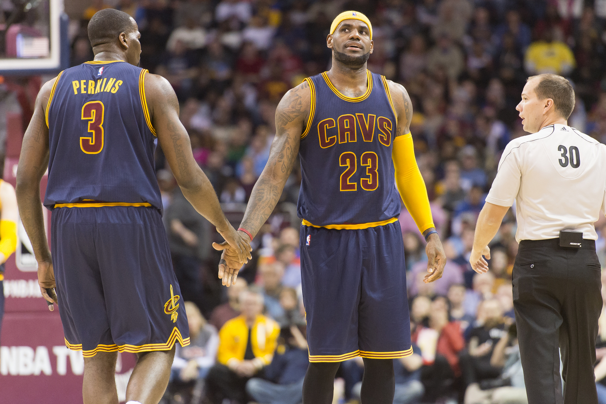 Cleveland Cavaliers LeBron James and Kendrick Perkins celebrate after a play.