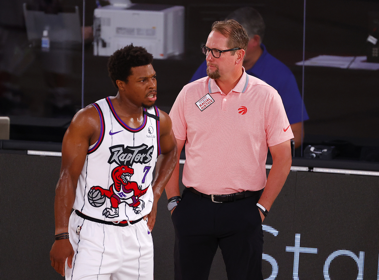 Kyle Lowry and Nick Nurse of the Toronto Raptors standing close to one another.