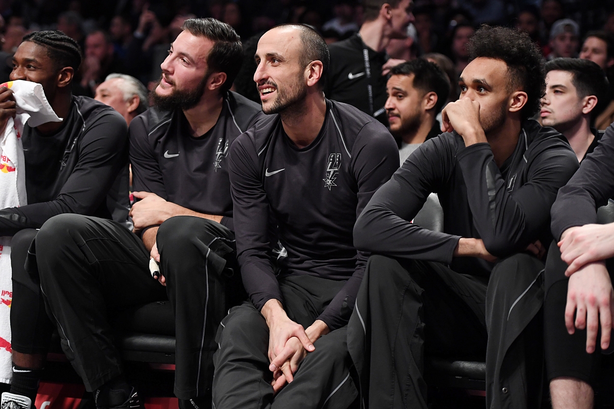 The San Antonio Spurs' Manu Ginobili sits on the bench during a game.