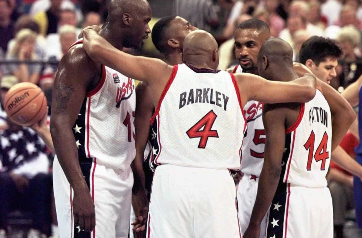 Shaquille O'Neal and Charles Barkley talk in a team USA huddle during the 1996 Summer Olympics.