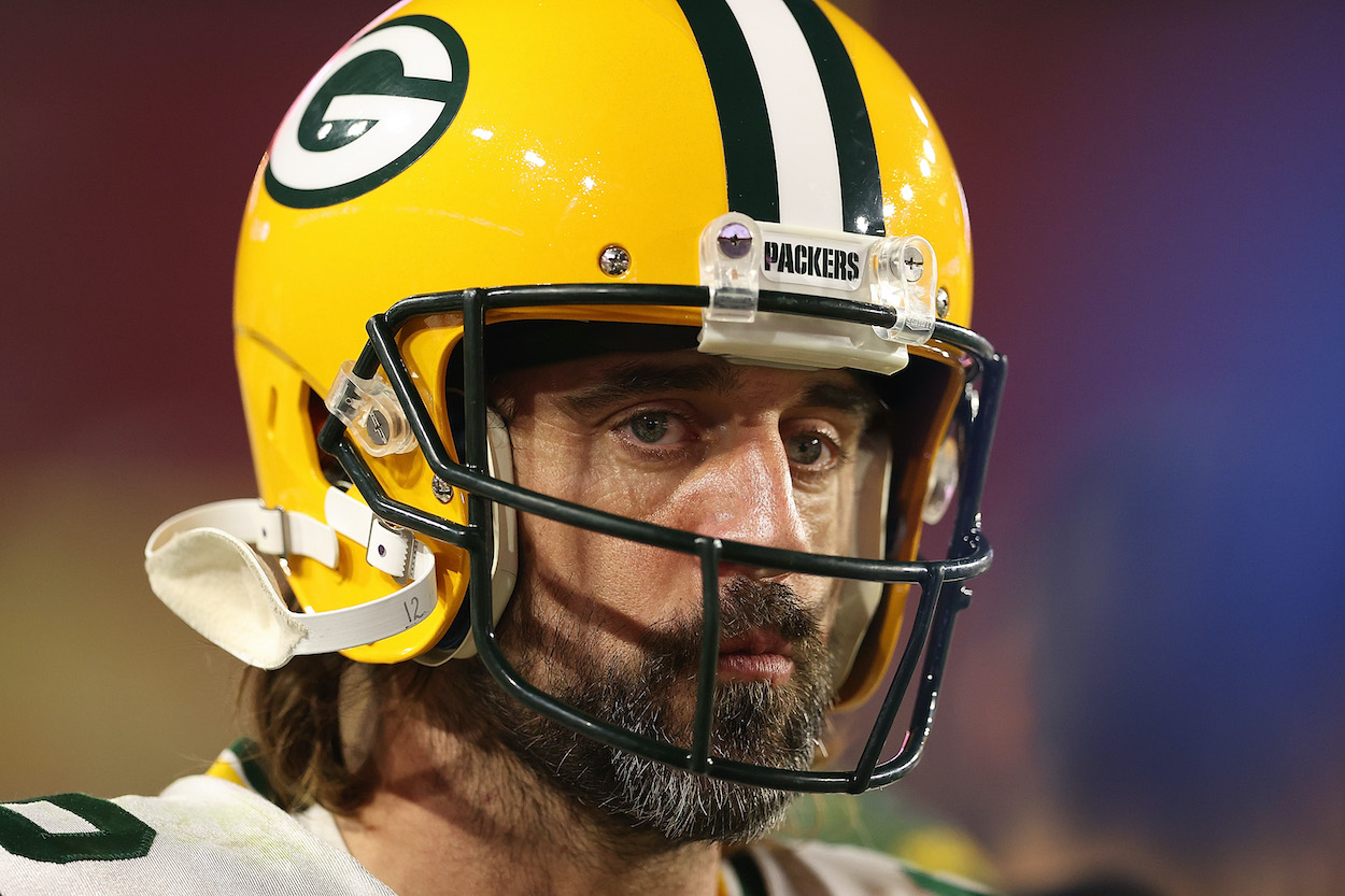 Aaron Rodgers of the Green Bay Packers, who appeared on the 'Pat McAfee Show' on Tuesday, watches action during the second half of a game against the Arizona Cardinals at State Farm Stadium on October 28, 2021 in Glendale, Arizona.