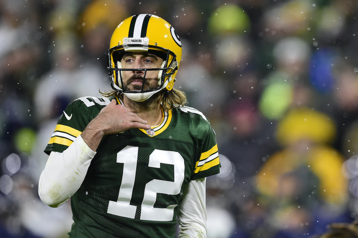 Aaron Rodgers of the Green Bay Packers, who is known for the Aaron Rodgers belt celebration, calls a play at the line of scrimmage against the Seattle Seahawks in the second half at Lambeau Field on November 14, 2021 in Green Bay, Wisconsin.