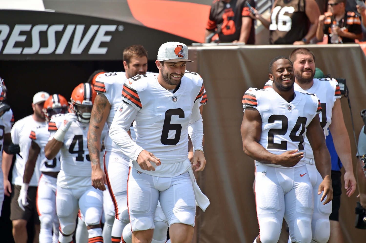 Baker Mayfield jogs out of the tunnel before a preseason game with his Cleveland Browns teammates.