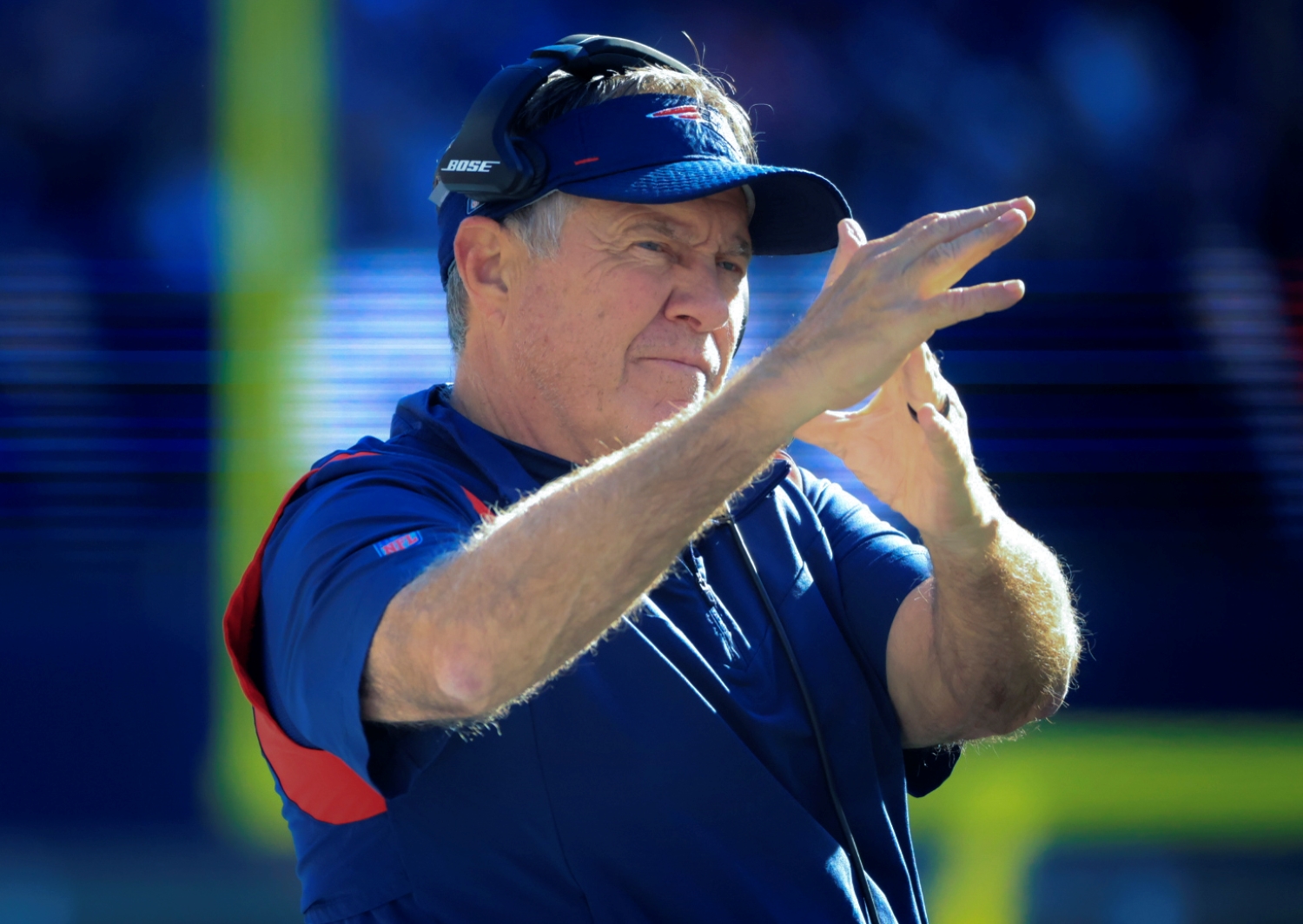 New England Patriots head coach Bill Belichick signals for a timeout.