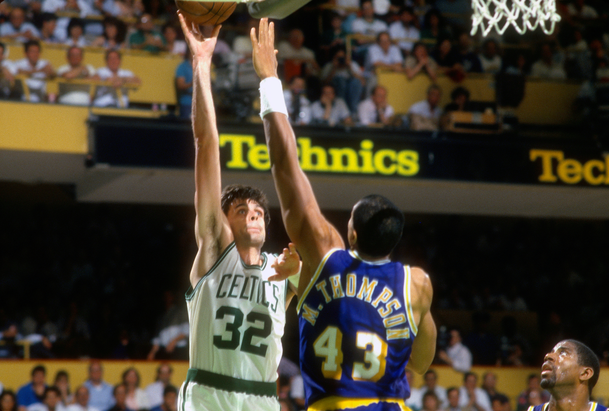 Kevin McHale of the Boston Celtics shoots over Mychal Thompson of the Los Angeles Lakers.