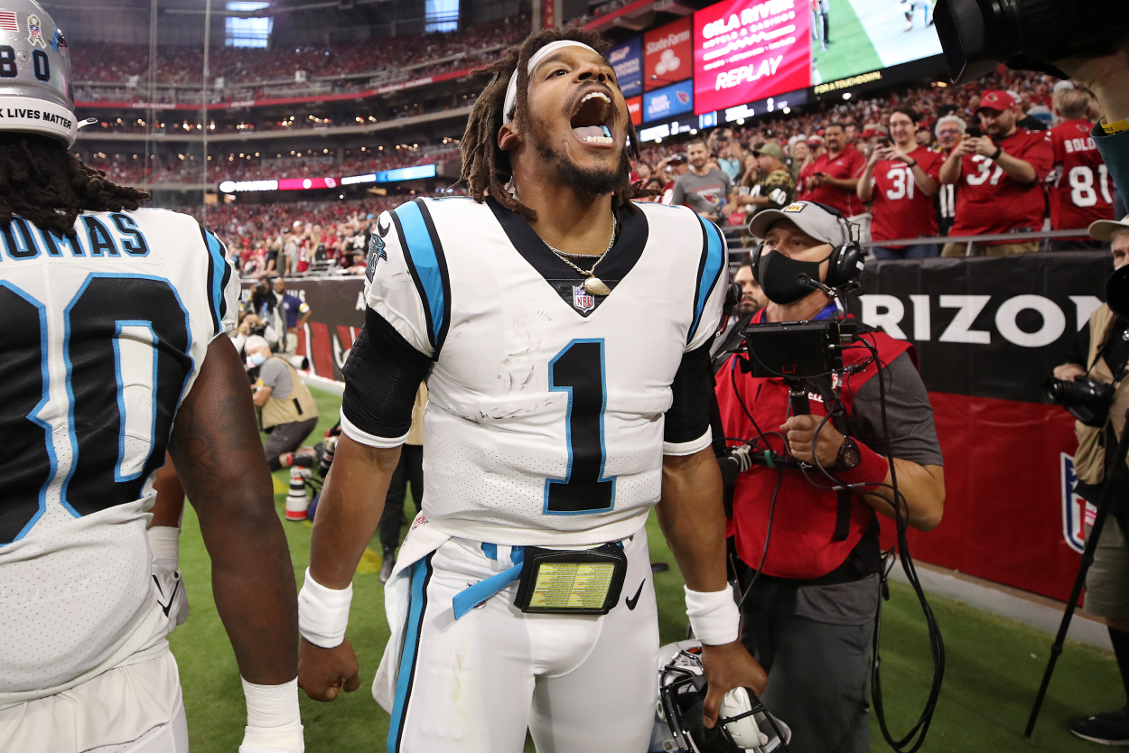 Cam Newton of the Carolina Panthers reacts after scoring on a rushing touchdown against the Arizona Cardinals.