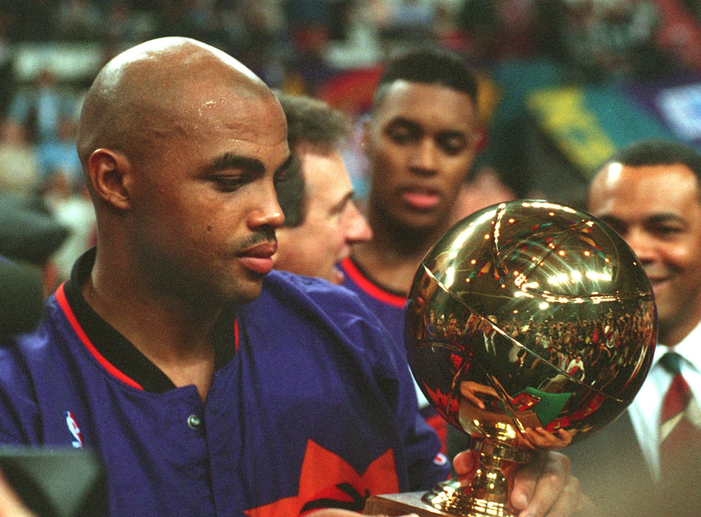 Former Phoenix Suns star Charles Barkley presented with a trophy at the McDonald's Open at October 1993