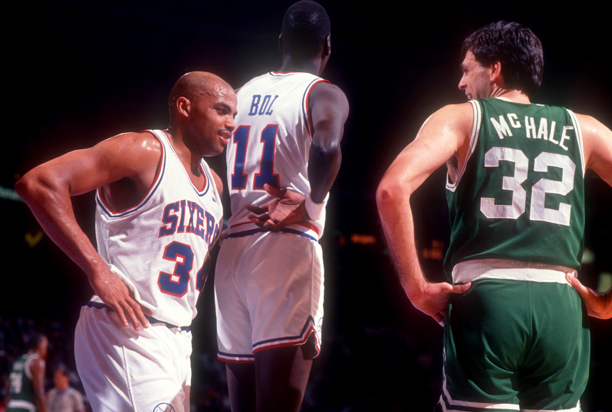Charles Barkley of the Philadelphia 76ers talks with Kevin McHale of the Boston Celtics.