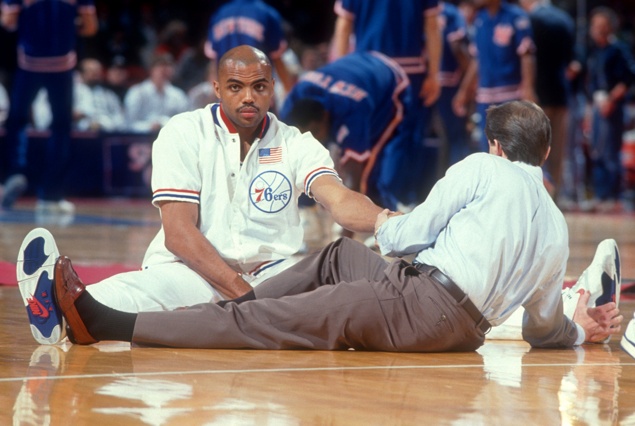 Charles Barkley of the Philadelphia 76ers stretches during warm-ups.