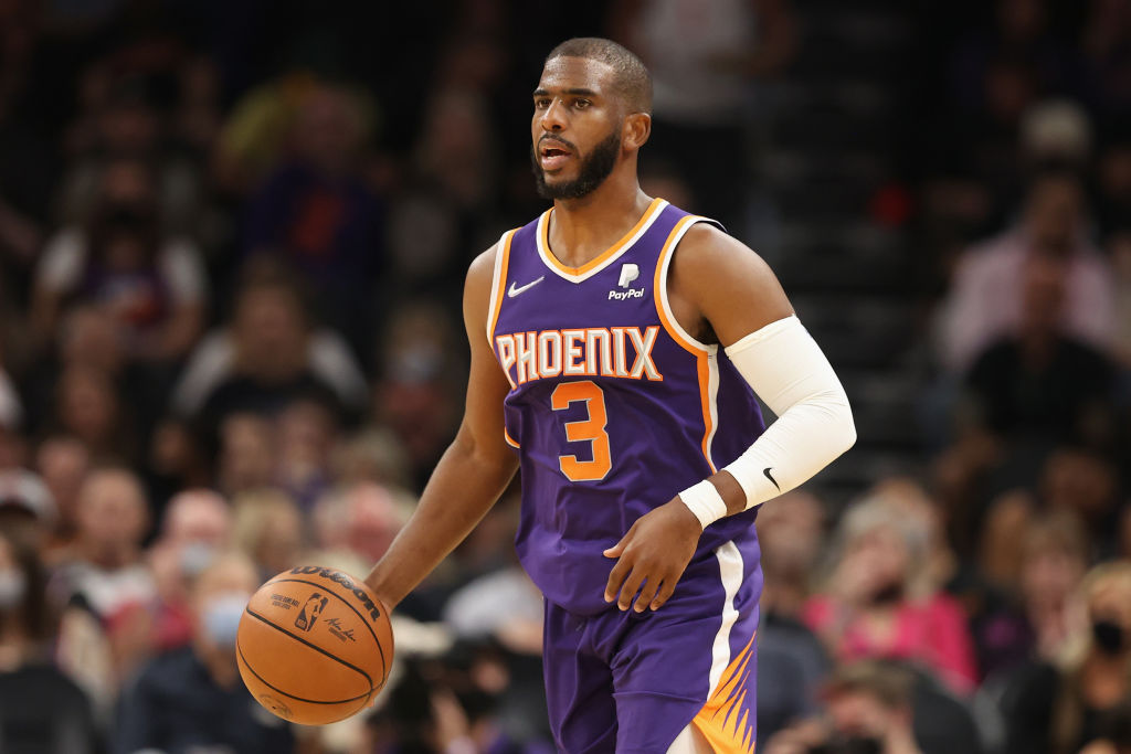 Phoenix Suns guard Chris Paul dribbles the ball up the court.