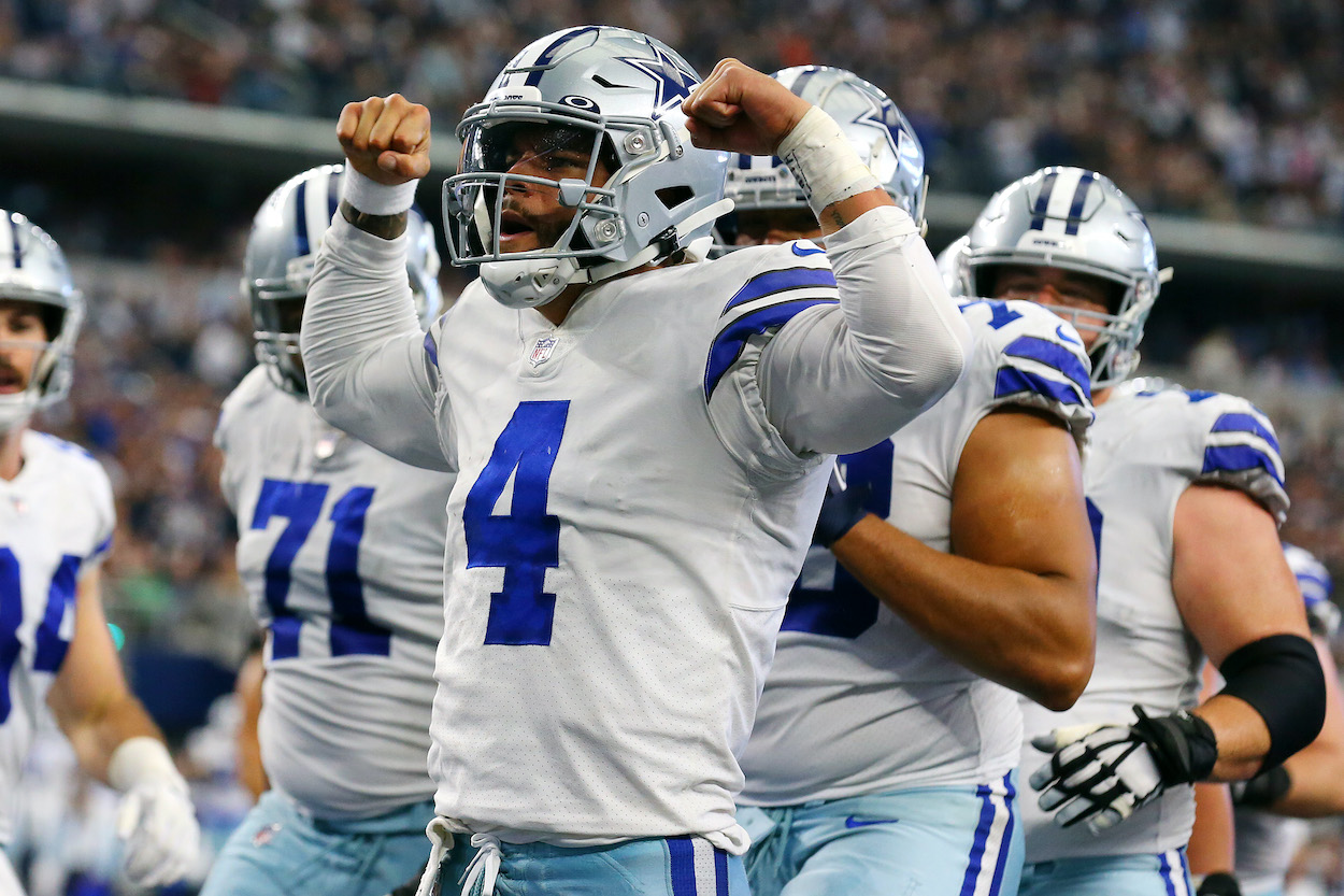 Dak Prescott of the Dallas Cowboys, who faces the Kansas City Chiefs in his NFL Week 11 matchup, celebrates his rushing touchdown against the Atlanta Falcons during the third quarter at AT&T Stadium on November 14, 2021 in Arlington, Texas.