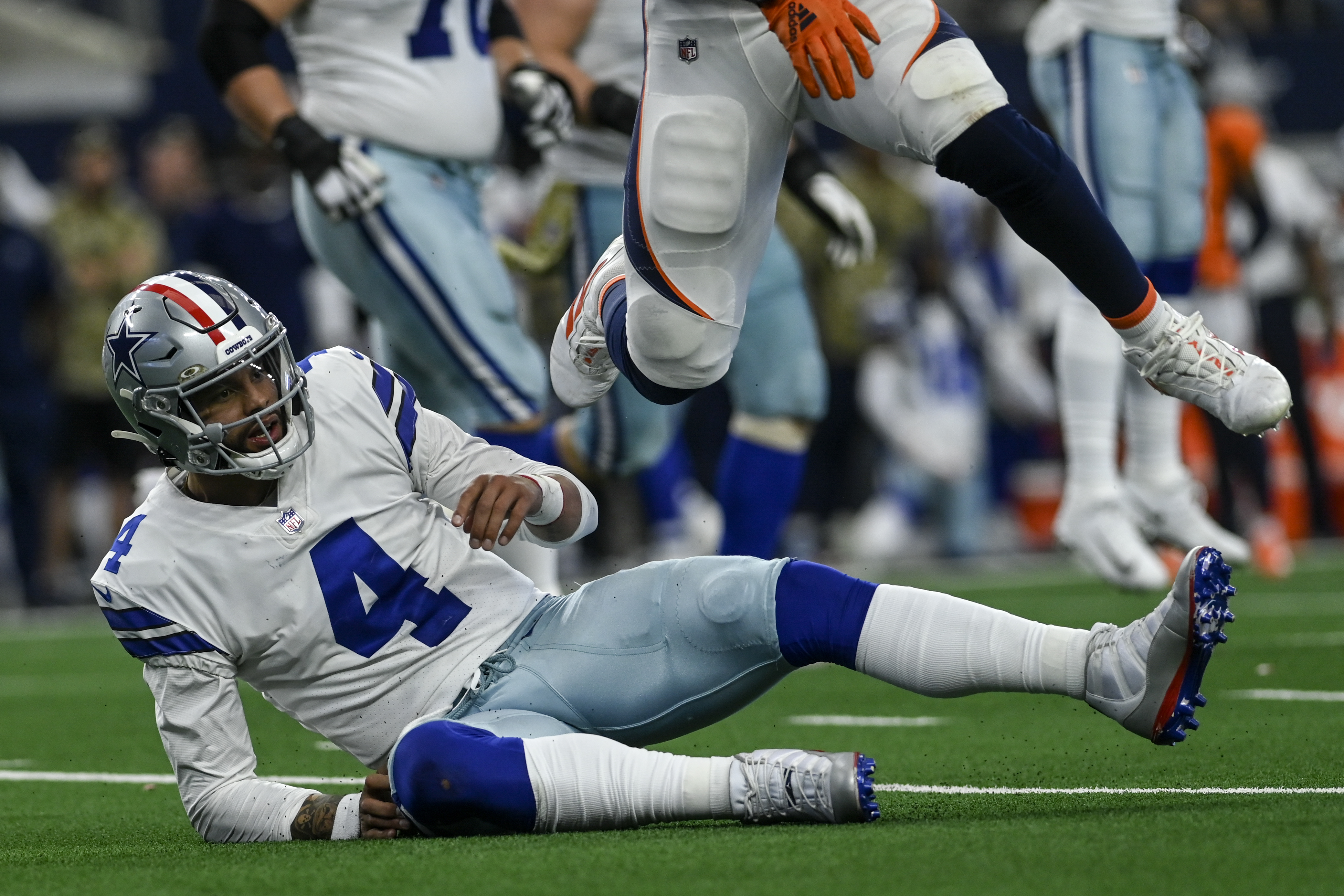 Cowboys QB Dak Prescott knocked down by Broncos defender after Mike McCarthy left him in the game