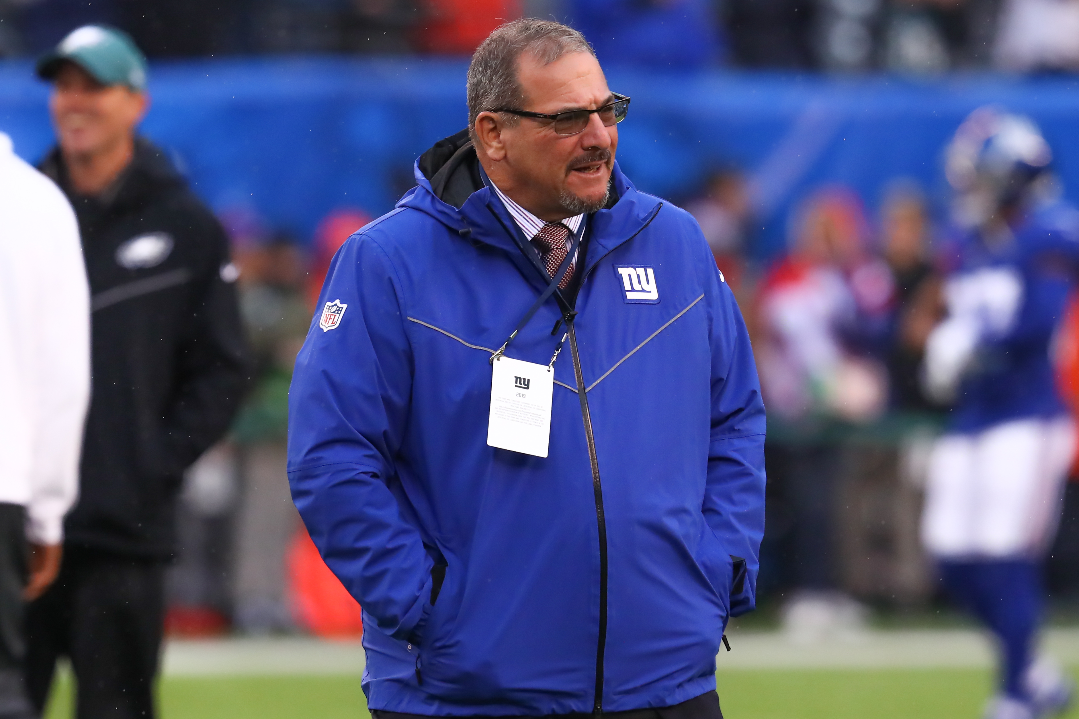 Giants general manager Dave Gettleman on the field before a game