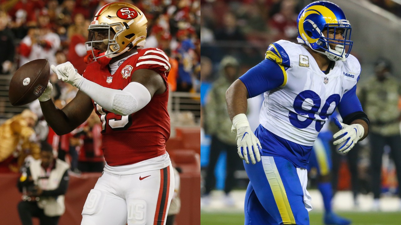 49ers WR Deebo Samuel reacts after touchdown; Rams defensive lineman Aaron Donald in action