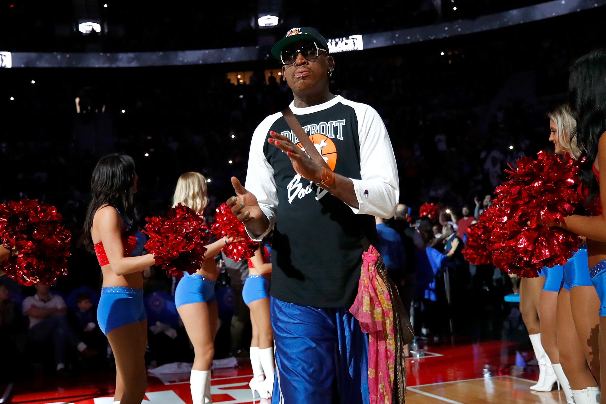 Former Detroit Piston Dennis Rodman takes the floor for a halftime ceremony.