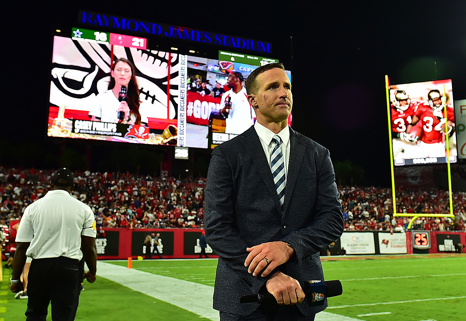 Former Saints quarterback looks on during an NFL game