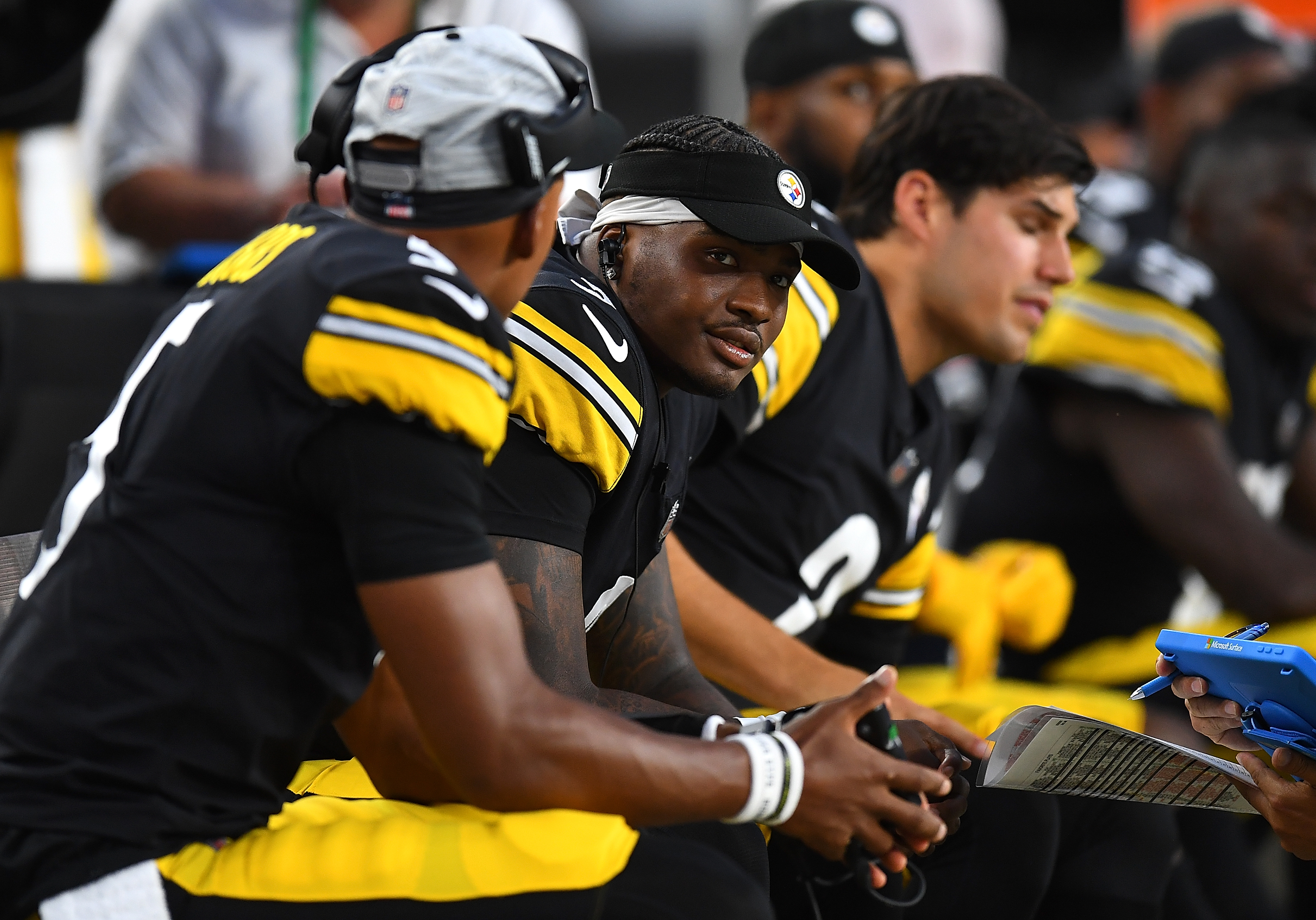 Steelers QB Dwayne Haskins Jr. looks on with his teammates