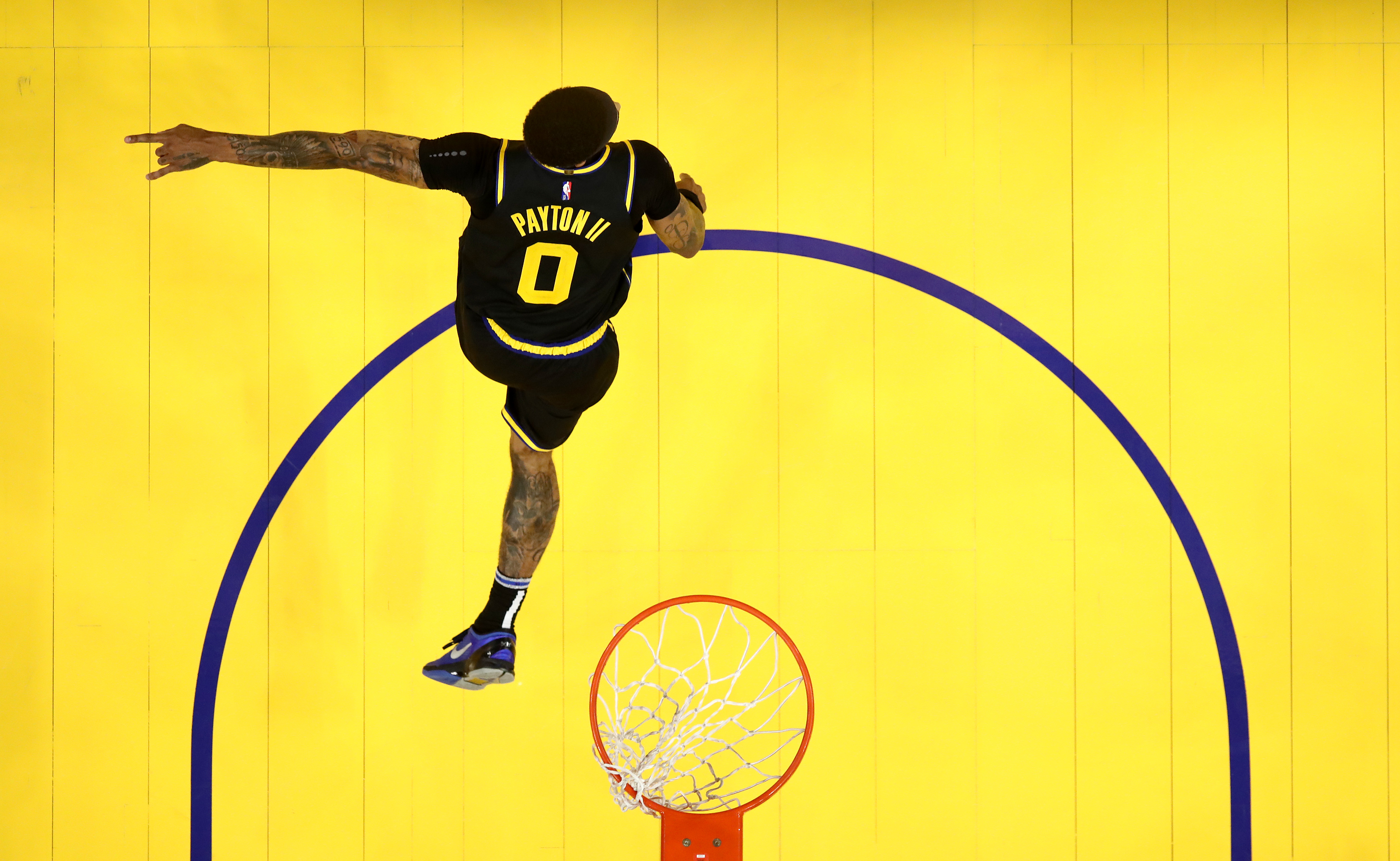 Golden State Warriors guard Gary Payton II runs back up the floor
