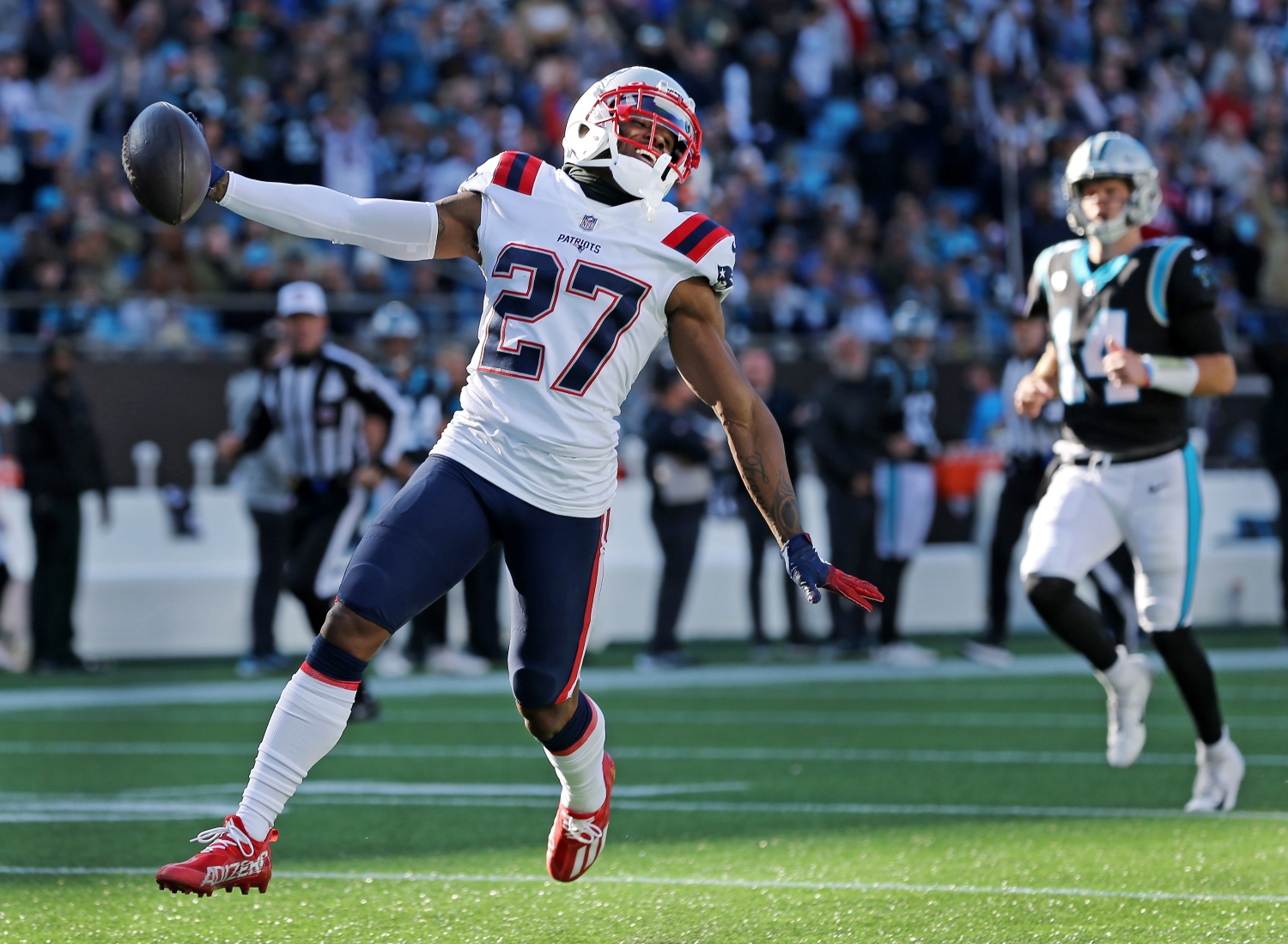 New England Patriots cornerback J.C. Jackson scores a touchdown after recording an interception against Carolina Panthers QB Sam Darnold.