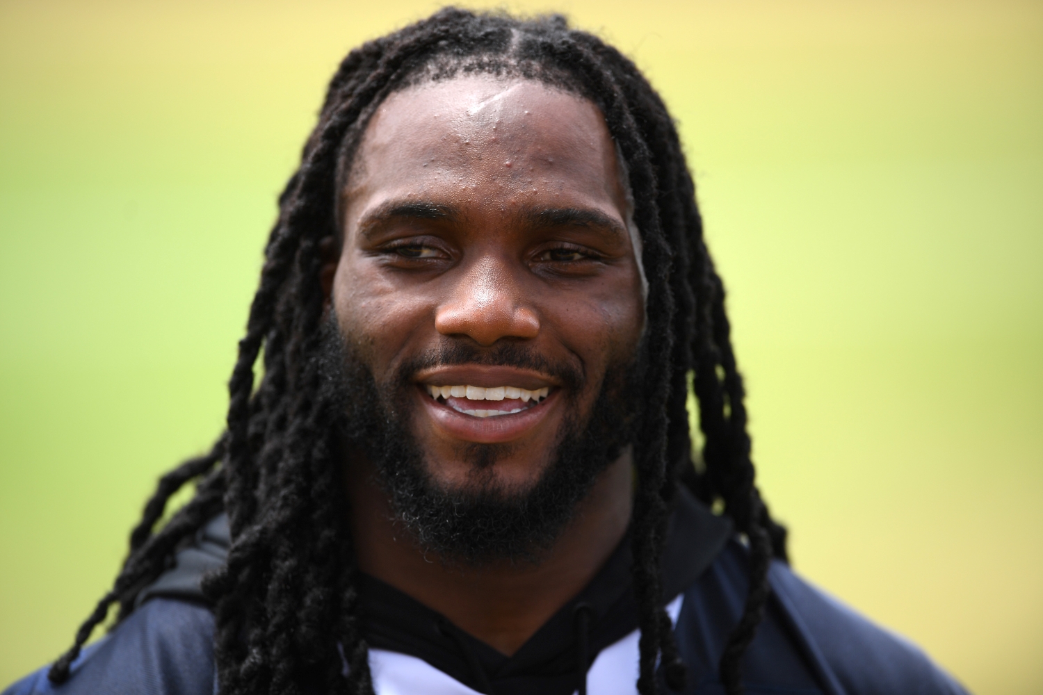 Jaylon Smith speaks to the media during training camp.