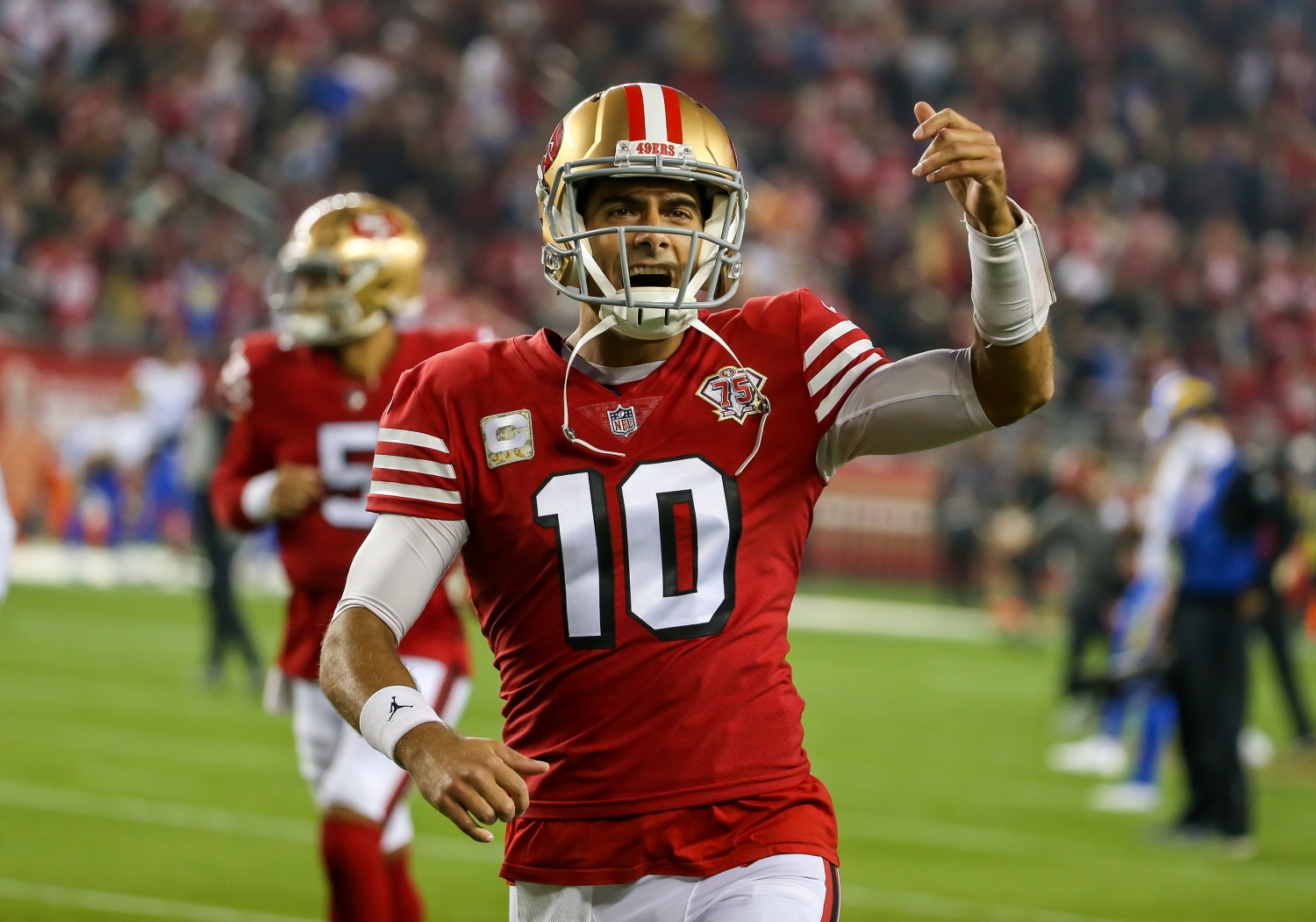 San Francisco 49ers QB Jimmy Garoppolo fires up the crowd before a game against the Los Angeles Rams.