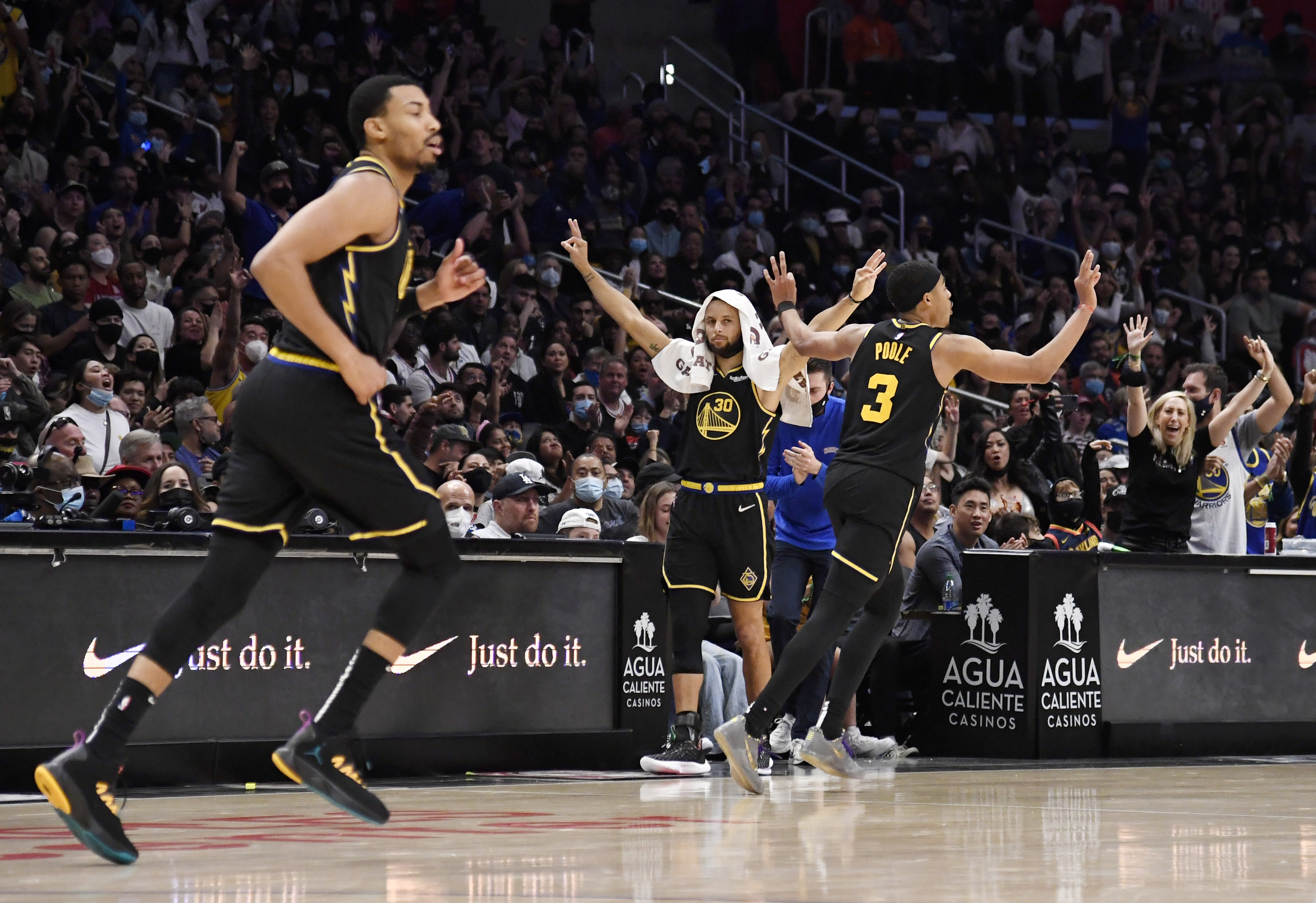 The Warriors celebrate a Jordan Poole 3-pointer during a game against the Los Angeles Clippers