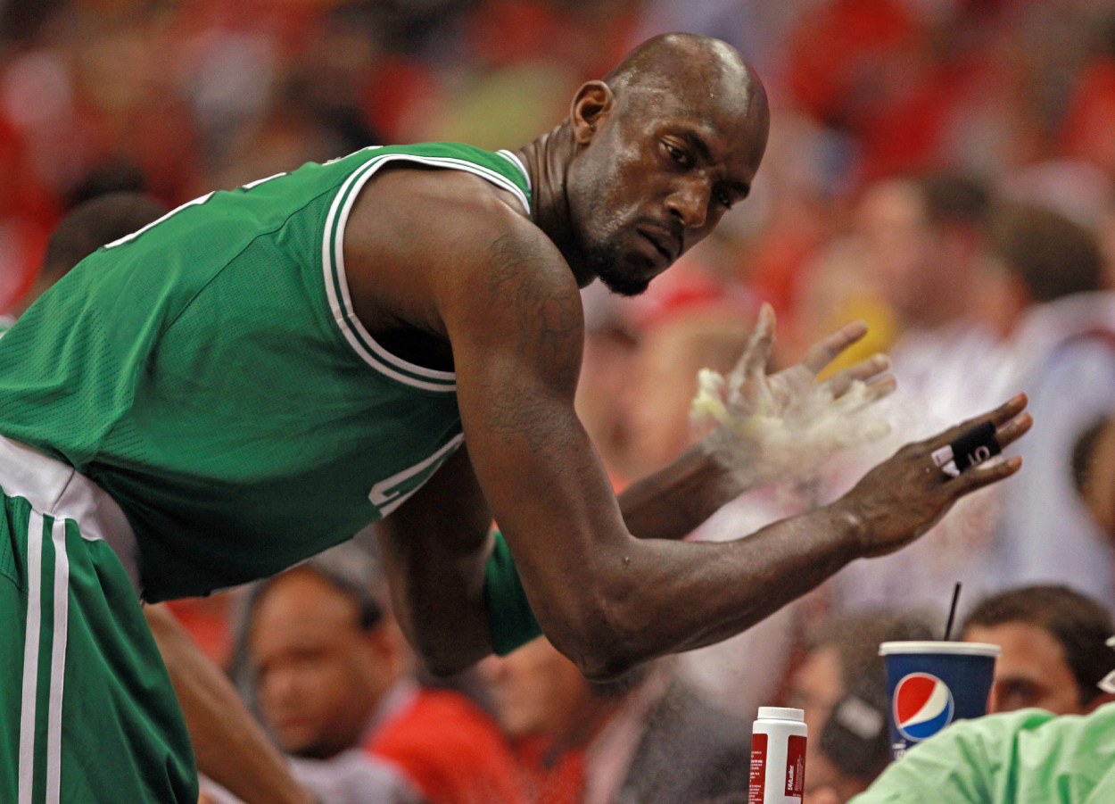 Boston Celtics power forward Kevin Garnett powders his hands.